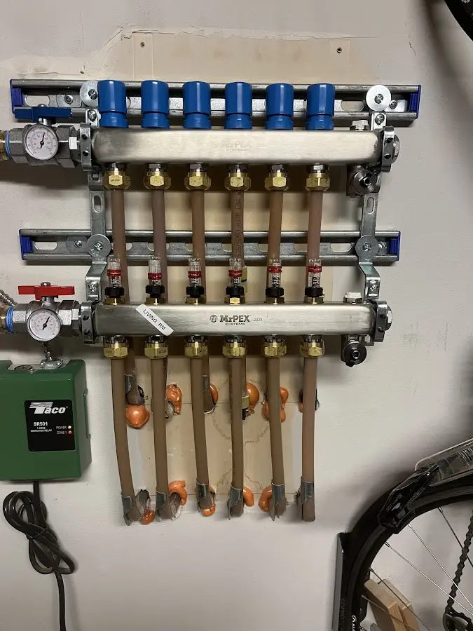 Plumber performing Water Heater Repair at a residential property in Country Homes